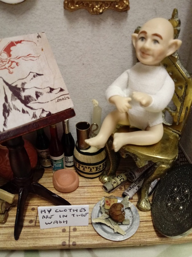 A miniature hobbit inside the Book Box made by Kate Price